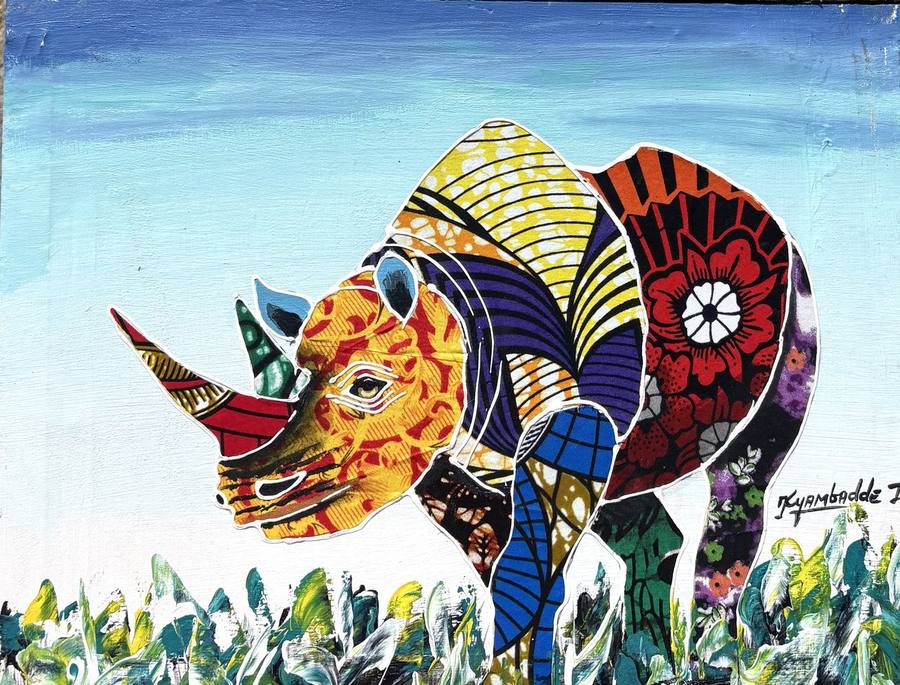Mixed-media painting of a rhinoceros with a body made of patchwork wax-print fabric