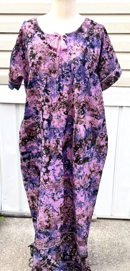 Purple and black batik-dyed caftan with a tasseled tie neckline and pockets
