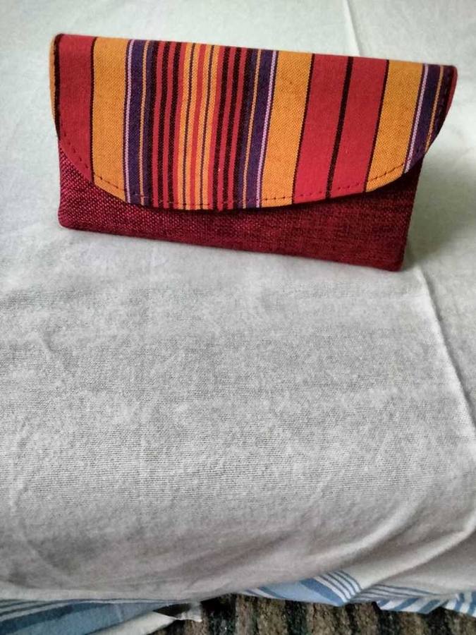 Berry, orange, and purple striped clutch wallet