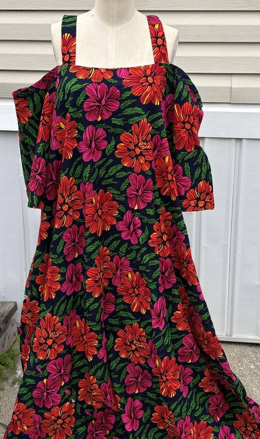 Navy cold-shoulder dress with a bold red, pink, and green floral print