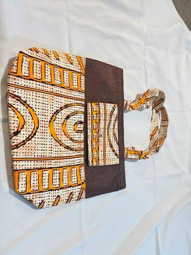 Orange and cream mudcloth-style print tote bag with a dark brown panel